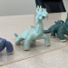 Fired and glazed wetmore clay dinosaurs